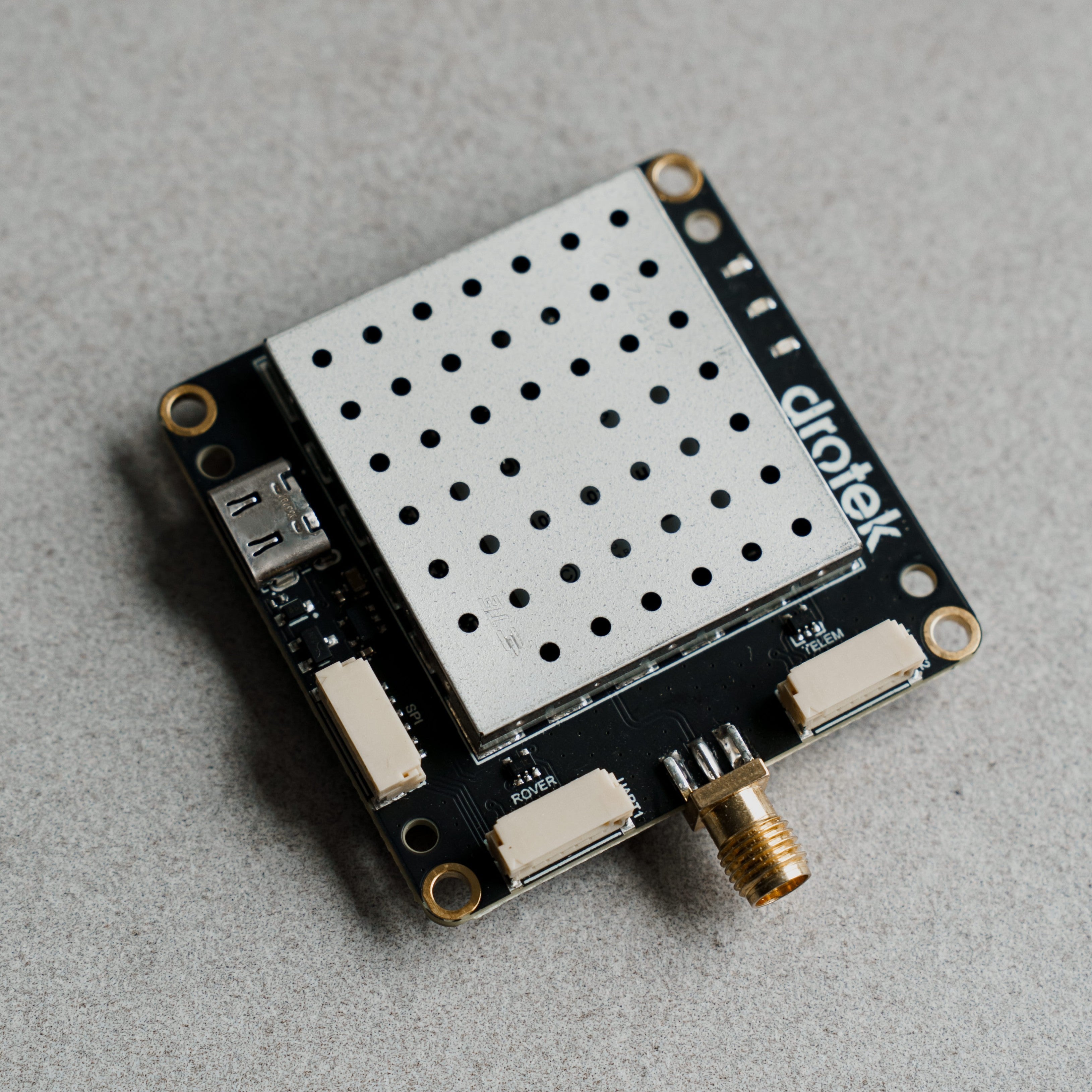 Siderion DP0601 ZED-F9P RTK GPS module on a gray background. Top view.