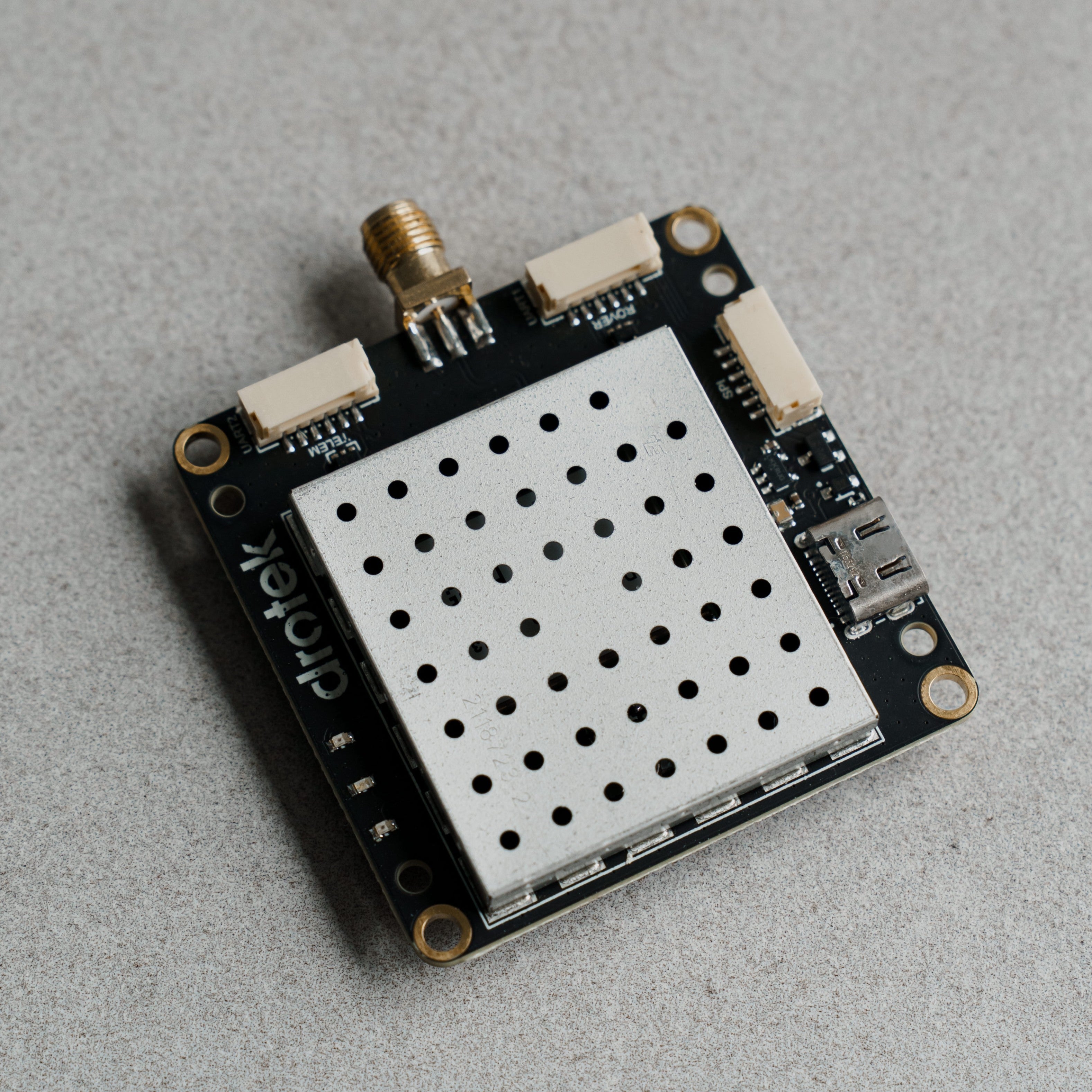 Siderion DP0601 ZED-F9P RTK GPS module on a gray background. Top isometric view.