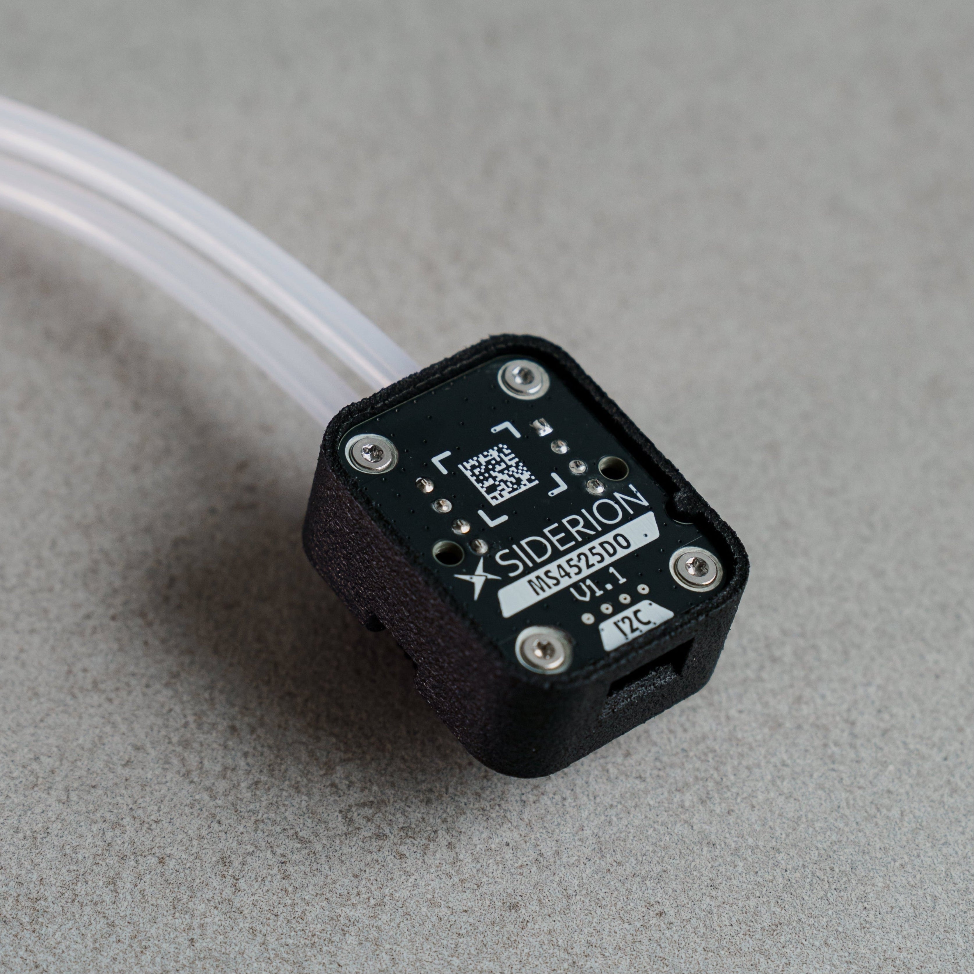 Siderion MS4525 Airspeed differential pressure sensor on a gray background. Silicone tubes visible.
