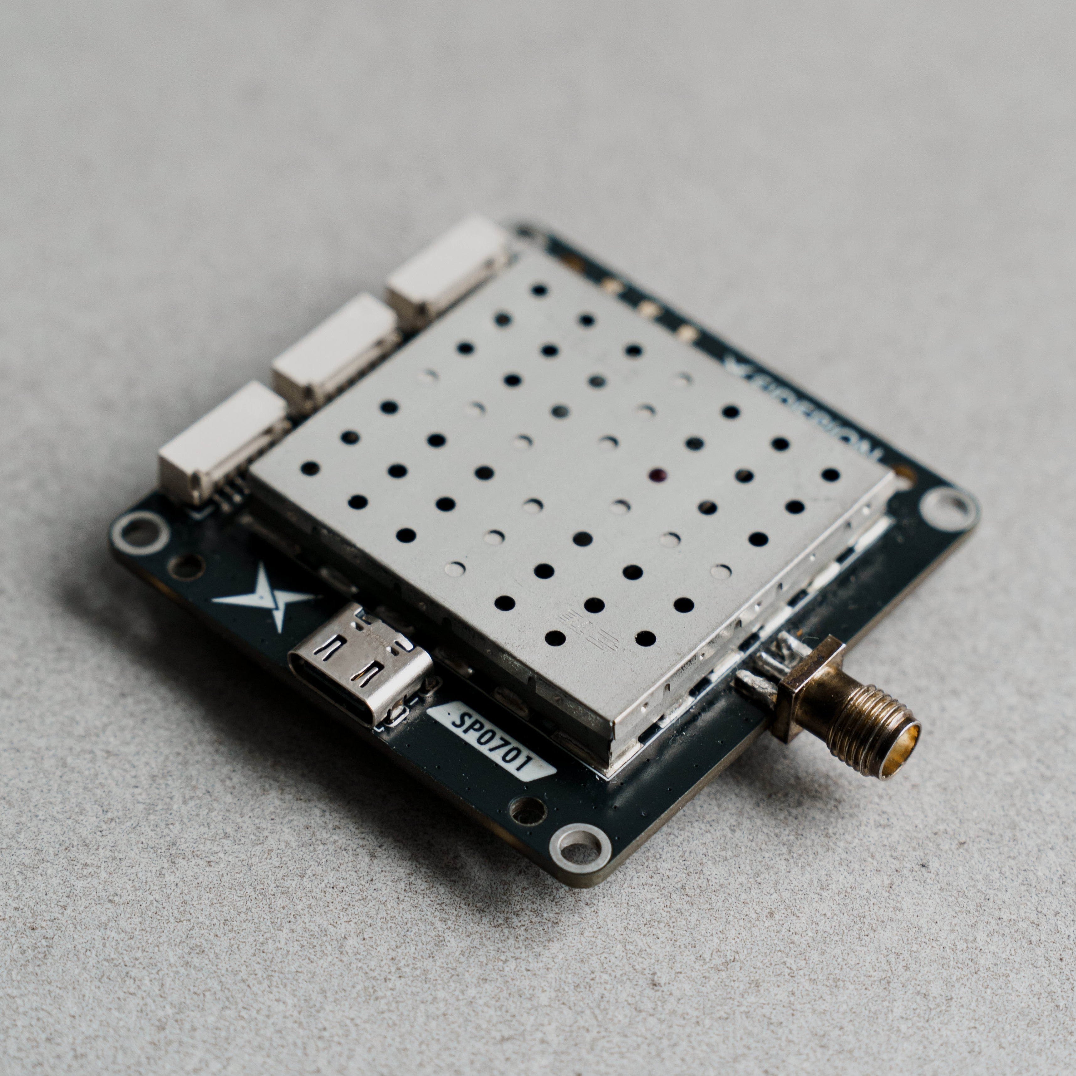 Siderion SP0701 ZED-F20P RTK GPS module on a gray background. Isometric view.