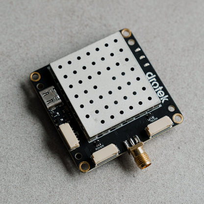 Siderion DP0601 ZED-F9P RTK GPS module on a gray background. Top view.