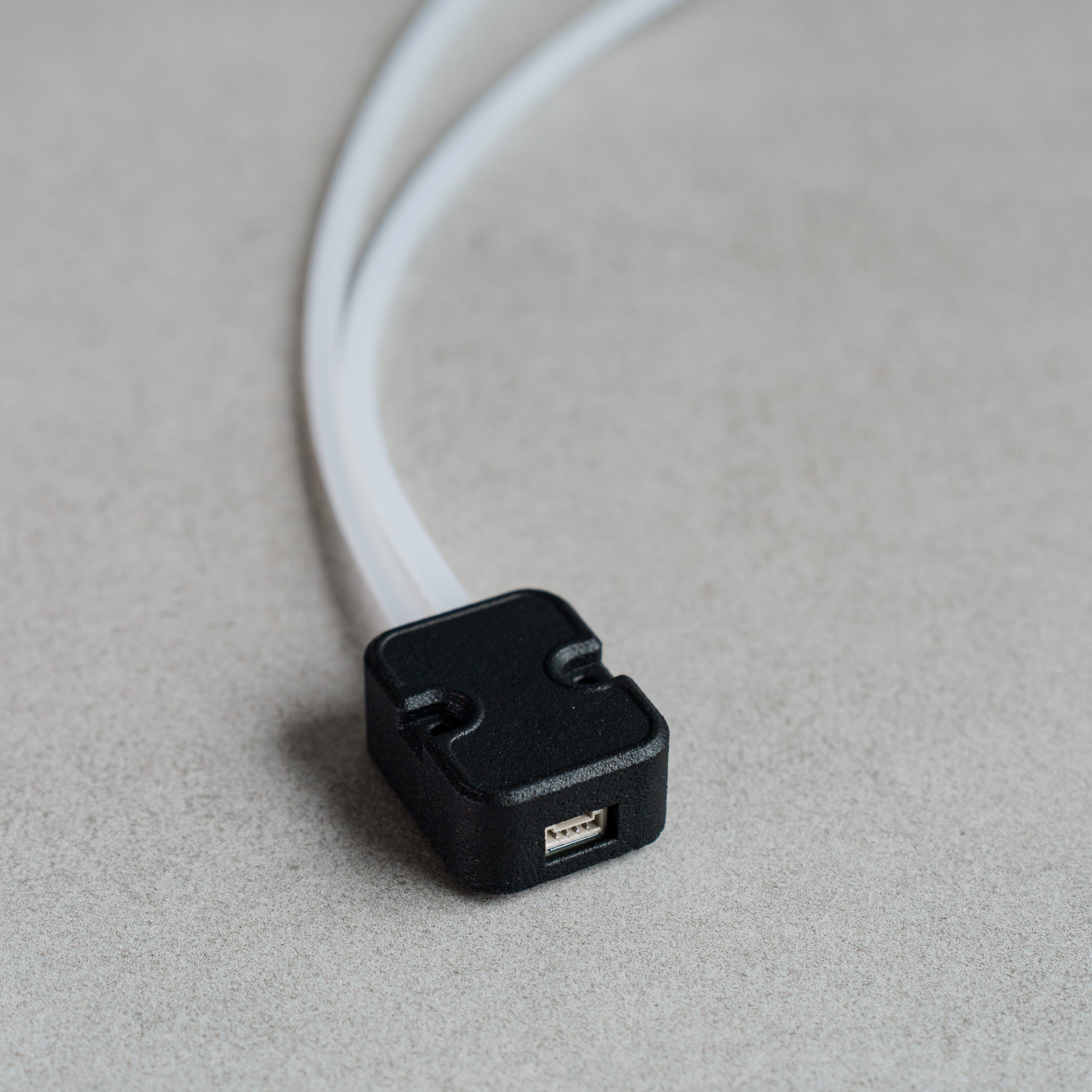 Siderion MS4525 Airspeed differential pressure sensor on a gray background. I2C input and silicone tubes visible.