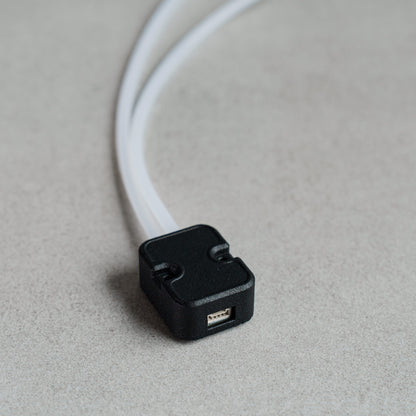 Siderion MS4525 Airspeed differential pressure sensor on a gray background. I2C input and silicone tubes visible.
