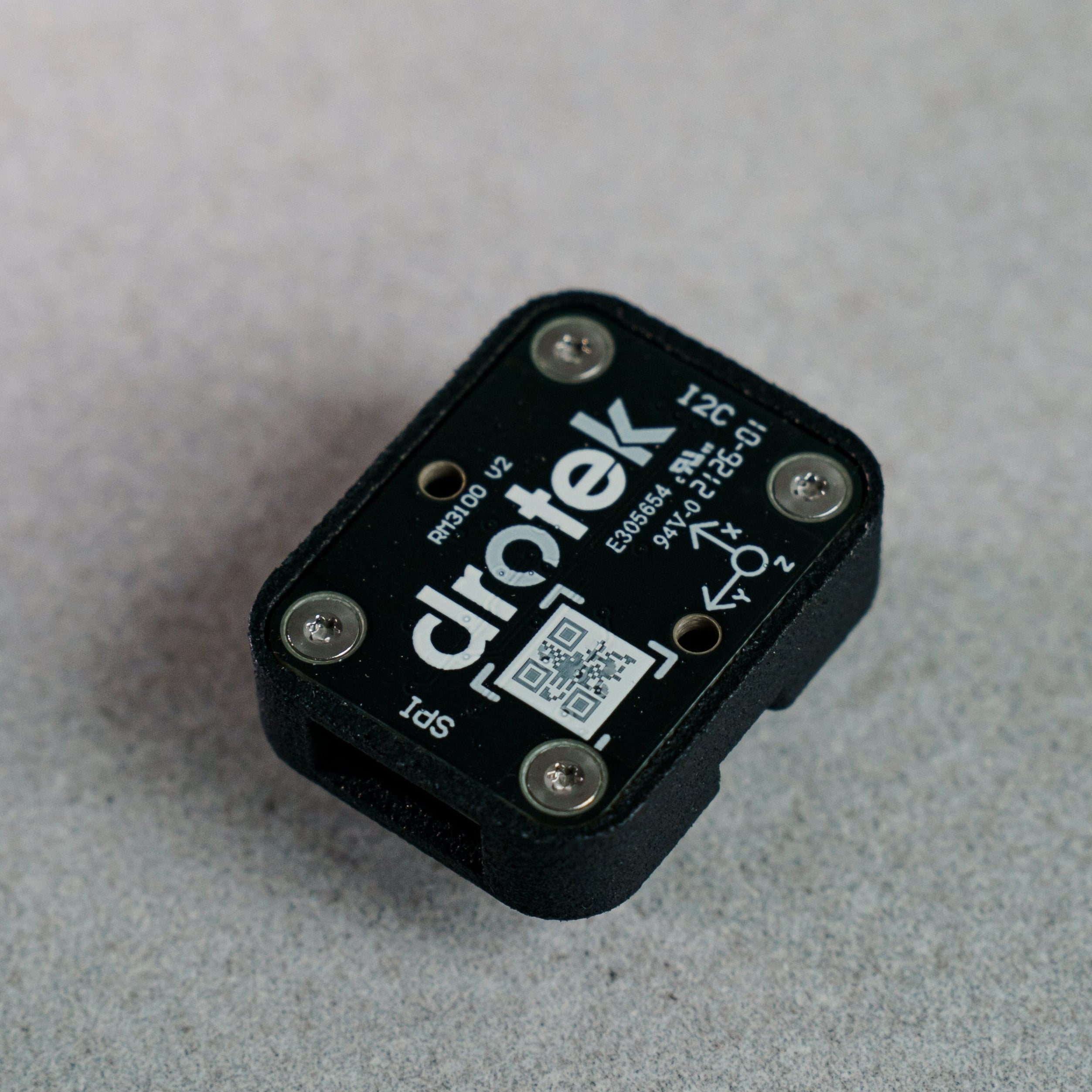 Siderion RM3100 professional magnetometer sensor on a gray background. 