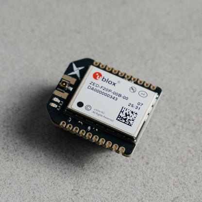 Siderion SP0700 ZED-F20P RTK GNSS device with u.FL connector, on a gray background. 
