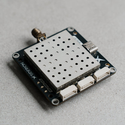 Siderion SP0701 ZED-F20P RTK GPS module on a gray background. 
