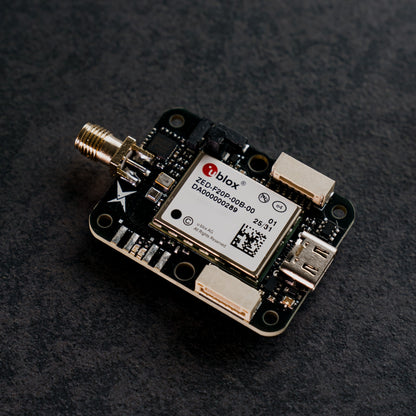 Siderion SP0703 ZED-F20P RTK GNSS module on a dark background. Top view.