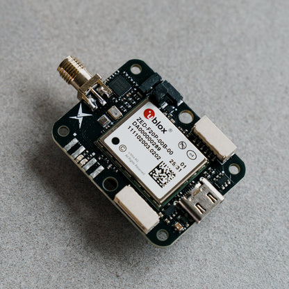 Siderion SP0703 ZED-F20P RTK GNSS module on a gray background. Top view.